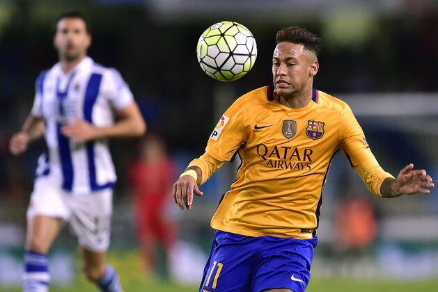 Barcelona's Neymar of Brazil, goes for the ball during their Spanish La Liga soccer match between Barcelona and Real Sociedad, at Anoeta stadium in San Sebastian, northern Spain, Saturday, April 9, 2016.  Barcelona lost the match 1-0. (AP Photo/Alvaro Barrientos)