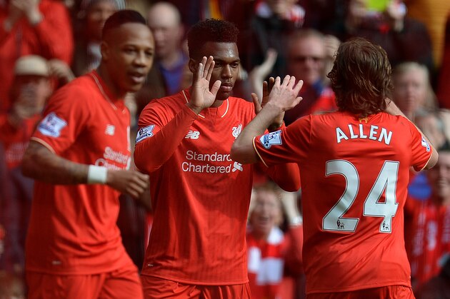 Liverpool's English striker Daniel Sturridge (C) celebrates scoring his team's second goal with Liverpool's Welsh midfielder Joe Allen during the English Premier League football match between Liverpool and Stoke City at Anfield in Liverpool, northwest England on April 10, 2016. / AFP / OLI SCARFF / RESTRICTED TO EDITORIAL USE. No use with unauthorized audio, video, data, fixture lists, club/league logos or 'live' services. Online in-match use limited to 75 images, no video emulation. No use in betting, games or single club/league/player publications.  /         (Photo credit should read OLI SCARFF/AFP/Getty Images)