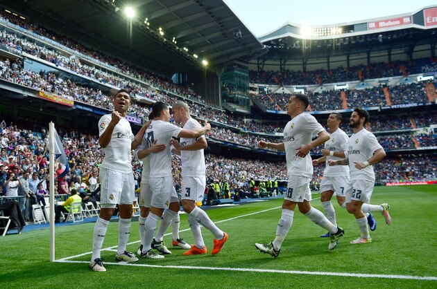 Real Madrid's Colombian midfielder James Rodriguez (2L) celebrates a goal with teammates during the Spanish league football match Real Madrid CF vs SD Eibar at the Santiago Bernabeu stadium in Madrid on April 9, 2016. / AFP / PIERRE-PHILIPPE MARCOU        (Photo credit should read PIERRE-PHILIPPE MARCOU/AFP/Getty Images)