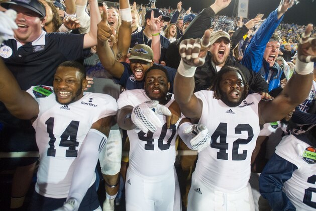 MOBILE, AL - DECEMBER 23: Safety Tay Hicklin #14, defensive end Ryan George #40, defensive end Nardo Govan #42 and running back Demarcus Godfrey #29 of the Georgia Southern Eagles celebrate with fans after defeating the Bowling Green Falcons on December 23, 2015 at Ladd Peebles Stadium in Mobile, Alabama. The Georgia Southern Eagles defeated the Bowling Green Falcons 58-27. (Photo by Michael Chang/Getty Images)
