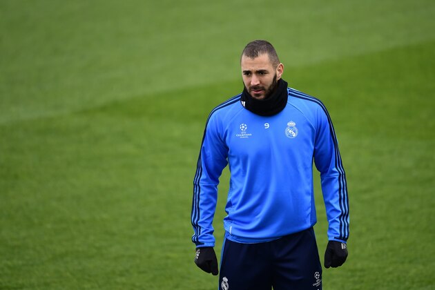 Real Madrid's French forward Karim Benzema looks on during a training session at Valdebebas Sport City in Madrid on April 11, 2016 on the eve of their Champions League second leg football match against Wolsburg.  / AFP / PIERRE-PHILIPPE MARCOU        (Photo credit should read PIERRE-PHILIPPE MARCOU/AFP/Getty Images)