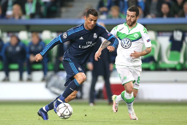 WOLFSBURG, GERMANY - APRIL 6: Cristiano Ronaldo of Real Madrid and Vieirinha of Wolfsburg in action during the UEFA Champions League quarter final first leg match between VfL Wolfsburg and Real Madrid at Volkswagen Arena on April 6, 2016 in Wolfsburg, Germany. (Photo by Jean Catuffe/Getty Images)