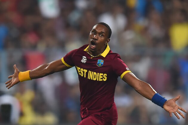 West Indies's Dwayne Bravo celebrates the wicket England's Moeen Ali during the World T20 cricket tournament final match between England and West Indies at The Eden Gardens Cricket Stadium in Kolkata on April 3, 2016.   / AFP / DIBYANGSHU SARKAR        (Photo credit should read DIBYANGSHU SARKAR/AFP/Getty Images)