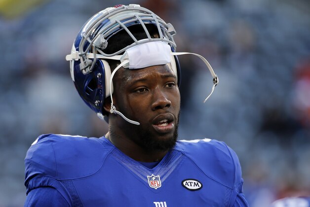 FILE - In this Jan. 3, 2016, file photo, New York Giants defensive end Jason Pierre-Paul (90) warms up before playing against the Philadelphia Eagles in an NFL football game in East Rutherford, N.J. Citing unfinished business, Pierre-Paul said Tuesday, March 8, 2016, he has agreed to terms on a new contract with the Giants.  (AP Photo/Julio Cortez, File)