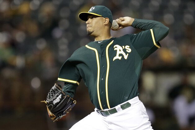 Oakland Athletics pitcher Felix Doubront works against the Texas Rangers during the first inning of a baseball game Wednesday, Sept. 23, 2015, in Oakland, Calif. (AP Photo/Ben Margot)