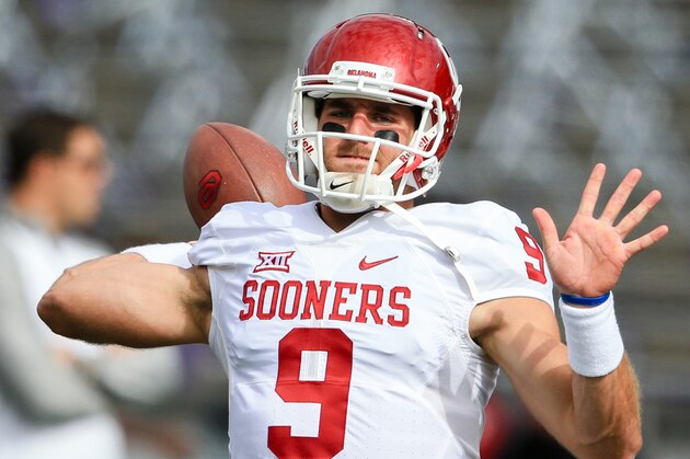 Oklahoma quarterback Trevor Knight (9) warms up before an NCAA college football game against Kansas State in Manhattan, Kan., Saturday, Oct. 17, 2015. (AP Photo/Nati Harnik)