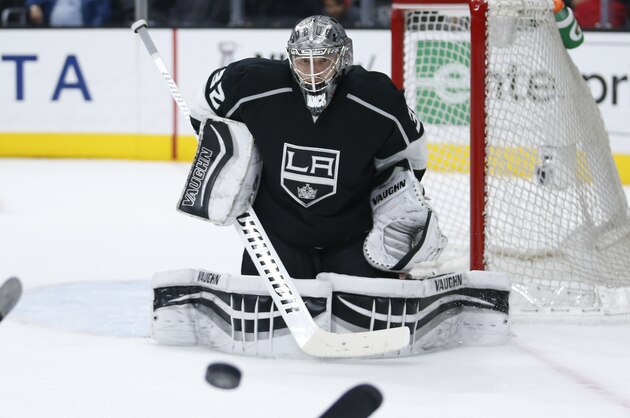 Los Angeles Kings goalie Jonathan Quick looks to the puck against the Winnipeg Jets during the third period of an NHL hockey game, Saturday, April 9, 2016, in Los Angeles. (AP Photo/Danny Moloshok)