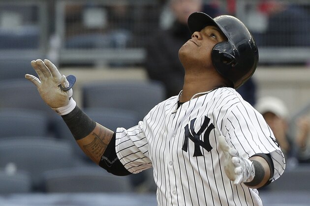 New York Yankees' Starlin Castro reacts as he crosses the plate after hitting a solo home run against the Houston Astros during the fourth inning of a baseball game, Thursday, April 7, 2016, in New York. (AP Photo/Julie Jacobson)