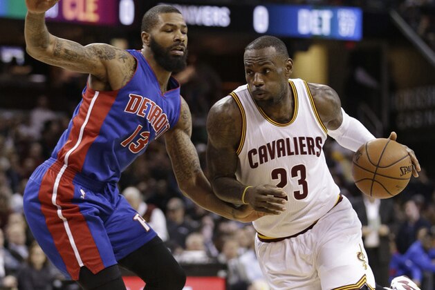 Cleveland Cavaliers' LeBron James (23) drives against Detroit Pistons' Marcus Morris (13) in the first half of an NBA basketball game Monday, Feb. 22, 2016, in Cleveland. (AP Photo/Tony Dejak)