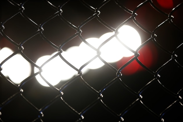 The chain link fence of the Octagon during UFC 157 in Anaheim, Calif., Saturday, Feb. 23, 2013. (AP Photo/Jae C. Hong)