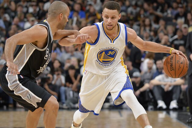 Golden State Warriors guard Stephen Curry (30) drives around San Antonio Spurs guard Tony Parker, of France, during the first half of an NBA basketball game, Sunday, April 10, 2016, in San Antonio. (AP Photo/Darren Abate)