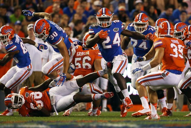 Apr 8, 2016; Gainesville, FL, USA; Florida Gators running back Mark Thompson (24) runs in the third quarter during the Orange and Blue game at Ben Hill Griffin Stadium. Blue won 38-6. Mandatory Credit: Logan Bowles-USA TODAY Sports