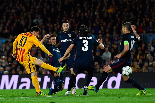 BARCELONA, SPAIN - APRIL 05:  Lionel Messi of FC Barcelona shoots towards goal under pressure of Club Atletico de Madrid players during the UEFA Champions League quarter final first leg match between FC Barcelona and Club Atletico de Madrid at Camp Nou on April 5, 2016 in Barcelona, Spain.  (Photo by David Ramos/Getty Images)