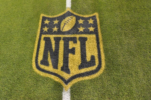 A general view of an NFL logo on the 50-yard line prior to an NFL football game between the Cleveland Browns and the Baltimore Ravens Monday, Nov. 30, 2015, in Cleveland. Baltimore won 33-27. (AP Photo/David Richard)