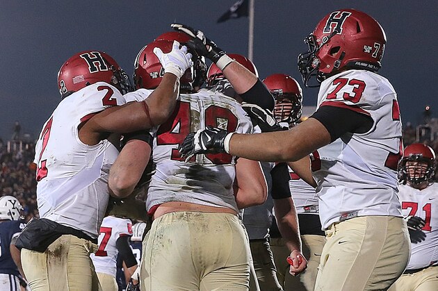 NEW HAVEN, CT - NOVEMBER 21: Ben Braunecker #48 of the Harvard Crimson celebrates with teammates after his touchdown in the second half against the Yale Bulldogs on November 21, 2015 in New Haven, Connecticut. (Photo by Jim Rogash/Getty Images) NEW HAVEN, CT - NOVEMBER 21: Ben Braunecker #48 of the Harvard Crimson celebrates with teammates after his touchdown in the second half against the Yale Bulldogs on November 21, 2015 in New Haven, Connecticut. (Photo by Jim Rogash/Getty Images)