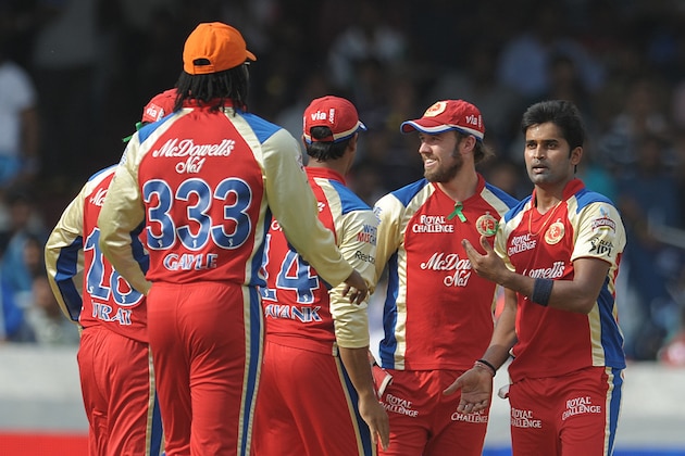 Royal Challengers Bangalore bowler Vinay Kumar (R) celebrates bowling Deccan chargers batsman Akshath Reddy during the IPL Twenty20 cricket match between the Deccan Chargers and Royal Challengers Bangalore at Rajiv Gandhi International Stadium in Hyderabad on May 20, 2012.  RESTRICTED TO EDITORIAL USE. MOBILE USE WITHIN NEWS PACKAGE. AFP PHOTO/ Noah SEELAM        (Photo credit should read NOAH SEELAM/AFP/GettyImages)
