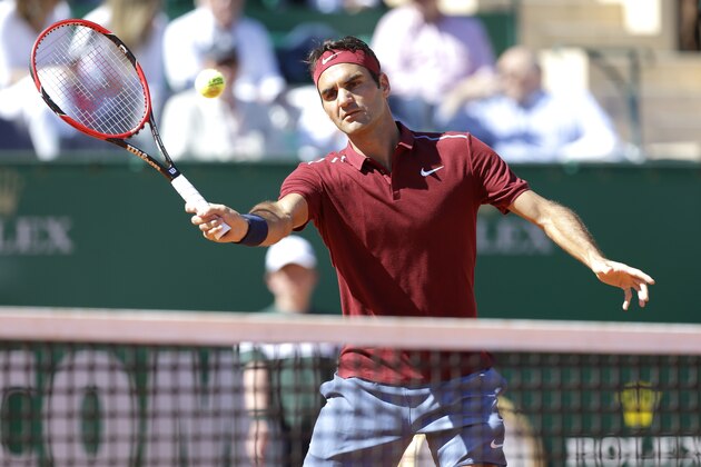 Swiss player Roger Federer plays a return to Guillermo Garcia Lopez of Spain during their match of the Monte Carlo Tennis Masters tournament in Monaco, Tuesday, April 12, 2016. (AP Photo/Lionel Cironneau)