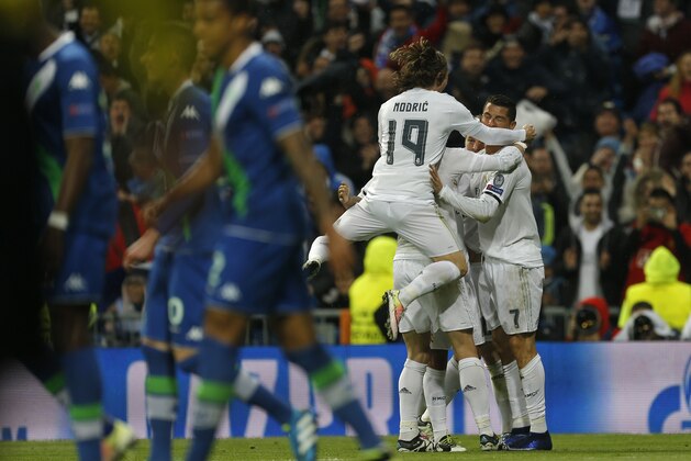 Real Madrid's Cristiano Ronaldo celebrates with team mates after scoring during the Champions League 2nd leg quarterfinal soccer match between Real Madrid and VfL Wolfsburg at the Santiago Bernabeu stadium in Madrid, Spain, Tuesday April 12, 2016. (AP Photo/Francisco Seco)