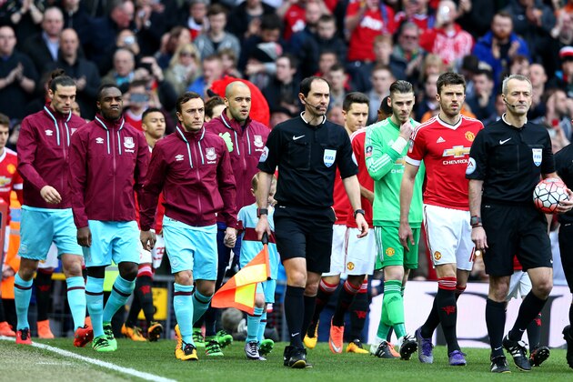 MANCHESTER, ENGLAND - MARCH 13: The teams are lead out on to the field by their captains Michael Carrick of Manchester United and Mark Noble of West Ham United prior to The Emirates FA Cup Sixth Round match between Manchester United and West Ham United at Old Trafford on March 13, 2016 in Manchester, England. (Photo by Clive Brunskill/Getty Images) MANCHESTER, ENGLAND - MARCH 13: The teams are lead out on to the field by their captains Michael Carrick of Manchester United and Mark Noble of West Ham United prior to The Emirates FA Cup Sixth Round match between Manchester United and West Ham United at Old Trafford on March 13, 2016 in Manchester, England. (Photo by Clive Brunskill/Getty Images)