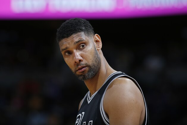 San Antonio Spurs center Tim Duncan looks back at a referee after being called for a foul against the Denver Nuggets during the second half of an NBA basketball game Friday, April 8, 2016, in Denver. The Nuggets won 102-98. (AP Photo/David Zalubowski)