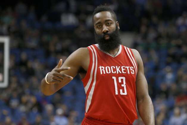 Houston Rockets guard James Harden (13) gestures to a teammate during the first half of an NBA basketball game against the Minnesota Timberwolves in Minneapolis, Monday, April 11, 2016. (AP Photo/Ann Heisenfelt)