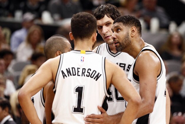 Apr 12, 2016; San Antonio, TX, USA; San Antonio Spurs power forward Tim Duncan (21, right) talks with teammates during the first half against the Oklahoma City Thunder at AT&T Center. Mandatory Credit: Soobum Im-USA TODAY Sports