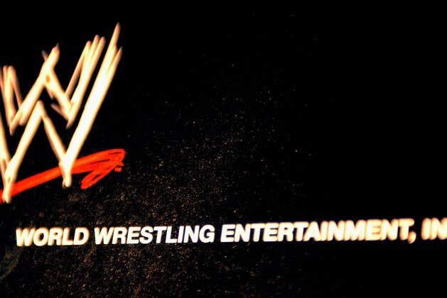 NEW YORK - MARCH 18:  The World Wrestling Entertainment logo hangs on a wall at a media conference announcing the all-star lineup of WWE WrestleMania XIX at ESPN Zone in Times Square March 18, 2003 in New York City.  (Photo by Mark Mainz/Getty Images)