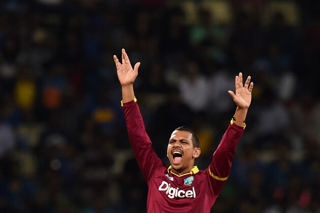West Indies cricketer Sunil Narine successfully appeals for a Leg Before Wicket (LBW) decision against Sri Lankan cricketer Tillakaratne Dilshan during the first Twenty20 International cricket match between Sri Lanka and the West Indies at the Pallekele International Cricket Stadium in Pallekele on November 9, 2015. AFP PHOTO/ ISHARA S KODIKARA        (Photo credit should read Ishara S.KODIKARA/AFP/Getty Images)