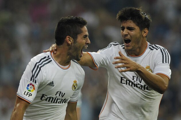 Real Madrid's Francisco Alarcon Isco, left, celebrates his goal with Alvaro Morata during a Spanish La Liga soccer match against Betis at the Santiago Bernabeu stadium in Madrid, Spain, Sunday, Aug. 18, 2013. (AP Photo/Andres Kudacki)