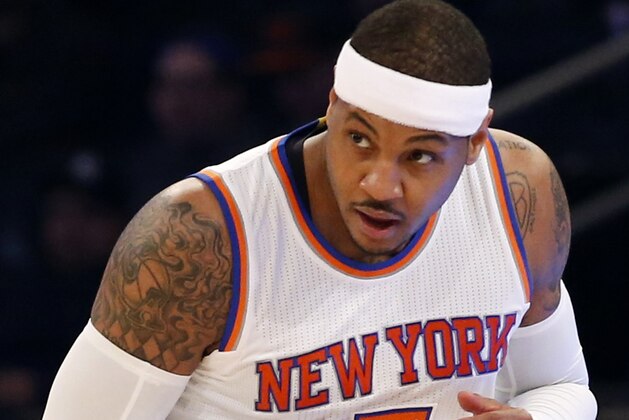 New York Knicks forward Carmelo Anthony (7) watches a play as he runs down court in the first half of an NBA basketball game against the Toronto Raptors at Madison Square Garden in New York, Sunday, April 10, 2016. (AP Photo/Kathy Willens)