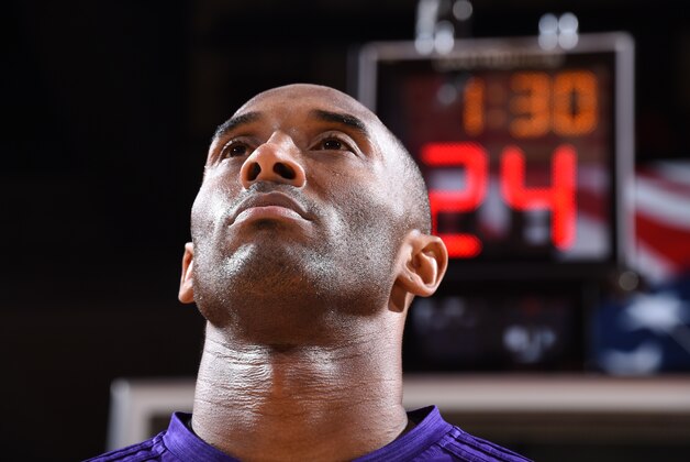 HOUSTON, TX - APRIL 10:  Kobe Bryant #24 of the Los Angeles Lakers stands for the national anthem before the game against the Houston Rockets on April 10, 2016 at the Toyota Center in Houston, Texas. NOTE TO USER: User expressly acknowledges and agrees that, by downloading and or using this photograph, User is consenting to the terms and conditions of the Getty Images License Agreement. Mandatory Copyright Notice: Copyright 2016 NBAE (Photo by Andrew D. Bernstein/NBAE via Getty Images)