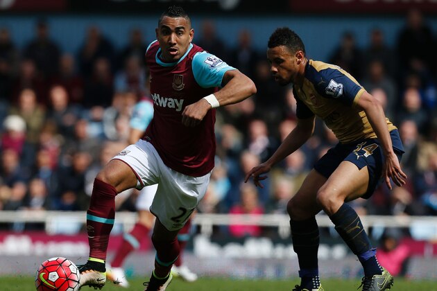 West Ham United's French midfielder Dimitri Payet (L) vies with Arsenal's French midfielder Francis Coquelin during the English Premier League football match between West Ham United and Arsenal at The Boleyn Ground in Upton Park, in east London on April 9, 2016.The match ended 3-3. / AFP / Ian Kington / RESTRICTED TO EDITORIAL USE. No use with unauthorized audio, video, data, fixture lists, club/league logos or 'live' services. Online in-match use limited to 75 images, no video emulation. No use in betting, games or single club/league/player publications. / (Photo credit should read IAN KINGTON/AFP/Getty Images) West Ham United's French midfielder Dimitri Payet (L) vies with Arsenal's French midfielder Francis Coquelin during the English Premier League football match between West Ham United and Arsenal at The Boleyn Ground in Upton Park, in east London on April 9, 2016.The match ended 3-3. / AFP / Ian Kington / RESTRICTED TO EDITORIAL USE. No use with unauthorized audio, video, data, fixture lists, club/league logos or 'live' services. Online in-match use limited to 75 images, no video emulation. No use in betting, games or single club/league/player publications. / (Photo credit should read IAN KINGTON/AFP/Getty Images)