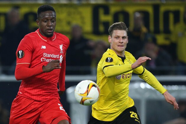 DORTMUND, GERMANY - APRIL 7: Divock Origi of Liverpool and Lukasz Piszczek of Dortmund in action during the UEFA Europa League quarter final first leg match between Borussia Dortmund and Liverpool FC at Signal Iduna Park aka Westfalenstadion on April 7, 2016 in Dortmund, Germany. (Photo by Jean Catuffe/Getty Images)