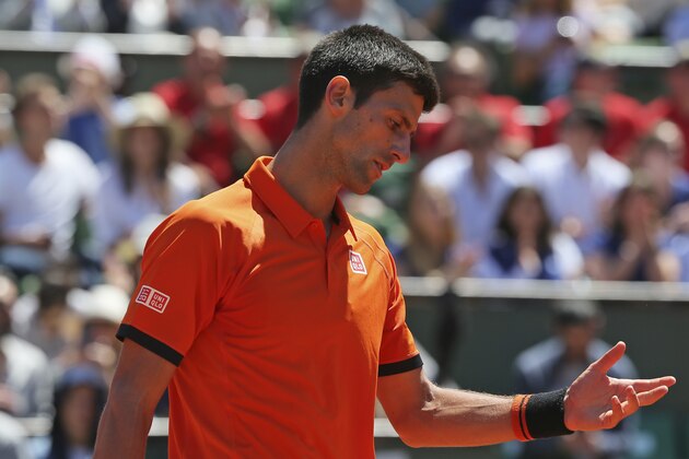 Serbia's Novak Djokovic gestures after missing a return in the semifinal match of the French Open tennis tournament against Britain's Andy Murray at the Roland Garros stadium, in Paris, France, Saturday, June 6, 2015. (AP Photo/David Vincent)
