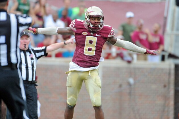 Sep 12, 2015; Tallahassee, FL, USA; Florida State Seminoles defensive back Jalen Ramsey (8) celebrates after a deflected pass during the first half of the game against the University of South Florida Bulls at Doak Campbell Stadium. Mandatory Credit: Melina Vastola-USA TODAY Sports