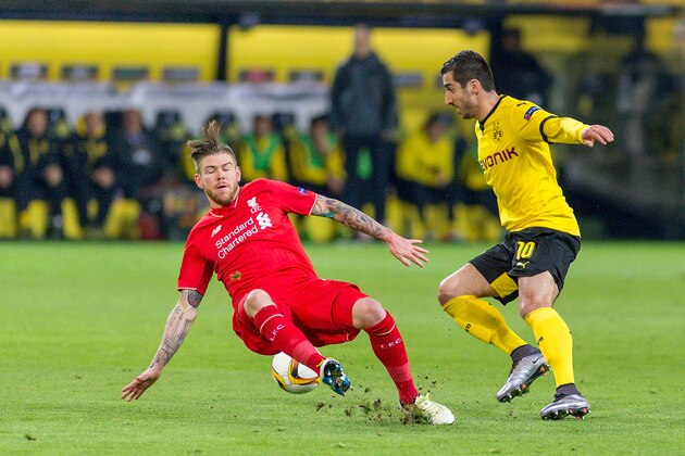 DORTMUND, GERMANY - APRIL 07: Defense Alberto Moreno (18) of FC Liverpool and Midfielder Henrikh Mkhitaryan (10) of Borussia Dortmund fighting for the ball at Signal Iduna Park during the UEFA Europa League quarter final first leg match between Borussia Dortmund and Liverpool on April 07, 2016 in Dortmund, Germany.  (Photo by Oliver Kremer at Pixolli Studios/Getty Images)