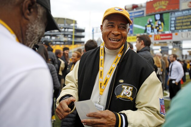 Former Pittsburgh Steelers pro football hall of fame wide receiver Lynn Swann takes part in festivities celebrating the 40th anniversary of the 1974 Steelers, the first Steelers Super Bowl team before an NFL football game between the Pittsburgh Steelers and the New Orleans Saints in Pittsburgh, Sunday, Nov. 30, 2014. (AP Photo/Gene J. Puskar)