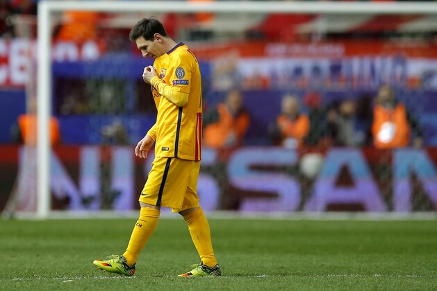 Barcelona's Lionel Messi walks on the pitch during the Champions League 2nd leg quarterfinal soccer match between Atletico Madrid and Barcelona at the Vicente Calderon stadium in Madrid, Spain, Wednesday April 13, 2016. Atletico defeated Barcelona by 2-0. (AP Photo/Paul White)