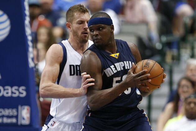 Memphis Grizzlies forward Zach Randolph (50) looks to drive the ball around Dallas Mavericks forward David Lee, left, during the first half of an NBA basketball game, Friday, April 8, 2016, in Dallas. (AP Photo/Jim Cowsert)