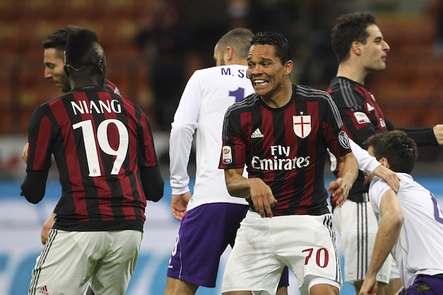 MILAN, ITALY - JANUARY 17:  Carlos Bacca (R) of AC Milan celebrates with his team-mate M Baye Niang (L) after scoring the opening goal during the Serie A match between AC Milan and ACF Fiorentina at Stadio Giuseppe Meazza on January 17, 2016 in Milan, Italy.  (Photo by Marco Luzzani/Getty Images)