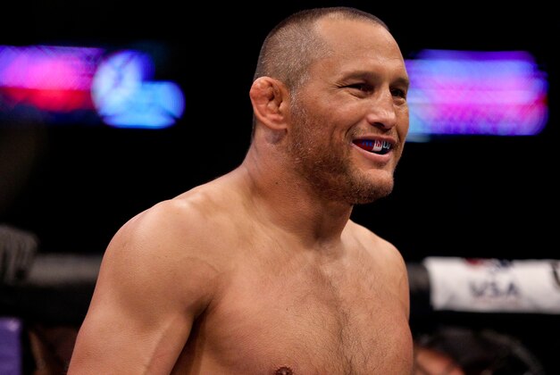 Jun 6, 2015; New Orleans, LA, USA; Dan Henderson (blue gloves) celebrates his win against Tim Boetsch (not pictured) during UFC Fight Night at the Smoothie King Center. Mandatory Credit: Derick E. Hingle-USA TODAY Sports Jun 6, 2015; New Orleans, LA, USA; Dan Henderson (blue gloves) celebrates his win against Tim Boetsch (not pictured) during UFC Fight Night at the Smoothie King Center. Mandatory Credit: Derick E. Hingle-USA TODAY Sports