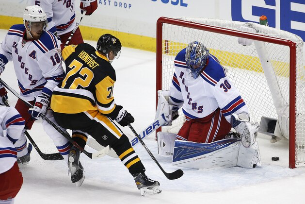 Pittsburgh Penguins' Patric Hornqvist (72) gets the puck past New York Rangers goalie Henrik Lundqvist (30) for a goal during the first period of a first-round NHL playoff hockey game in Pittsburgh, Wednesday, April 13, 2016. (AP Photo/Gene J. Puskar)