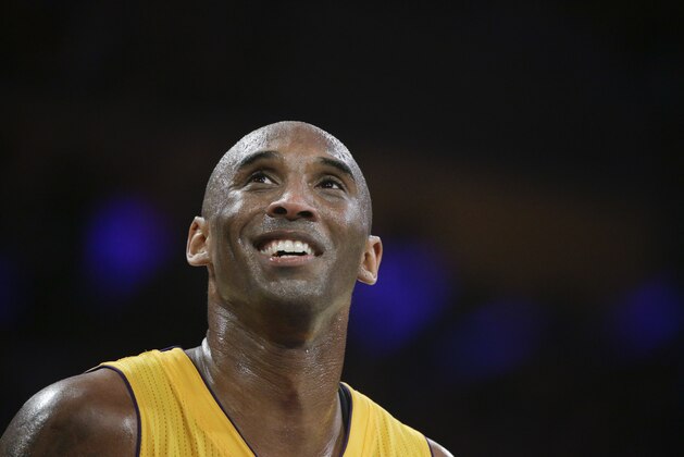 Los Angeles Lakers forward Kobe Bryant smiles during the first half of Bryant's last NBA basketball game, against the Utah Jazz on Wednesday, April 13, 2016, in Los Angeles. (AP Photo/Jae C. Hong)