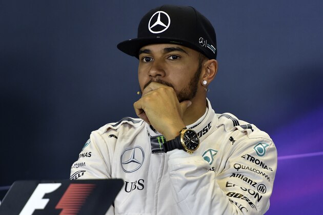 Mercedes AMG Petronas F1 Team's British driver Lewis Hamilton listens to a question during a press conference after he qualified in pole position for the Formula One Australian Grand Prix in Melbourne on March 19, 2016.  / AFP / SAEED KHAN / IMAGE RESTRICTED TO EDITORIAL USE - STRICTLY NO COMMERCIAL USE        (Photo credit should read SAEED KHAN/AFP/Getty Images)