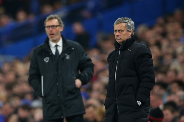 LONDON, ENGLAND - MARCH 11:  Opposing managers Jose Mourinho (R) the manager of Chelsea and Laurent Blanc (L) the head coach of PSG look on during the UEFA Champions League Round of 16, second leg match between Chelsea and Paris Saint-Germain at Stamford Bridge on March 11, 2015 in London, England.  (Photo by Paul Gilham/Getty Images)