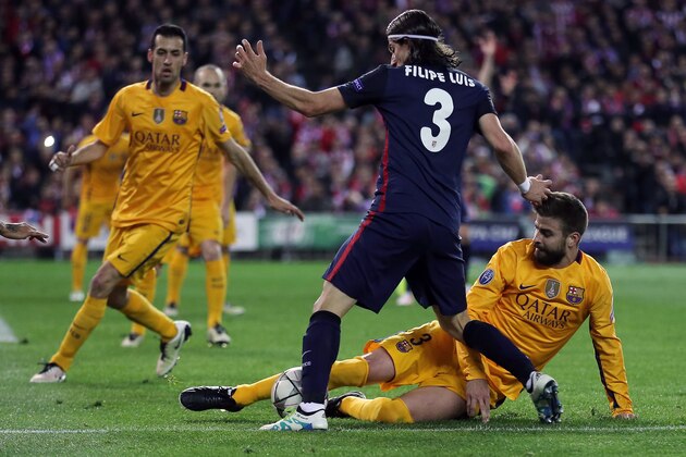 Atletico Madrid's Brazilian defender Filipe Luis (C) vies with Barcelona's defender Gerard Pique (R) during the Champions League quarter-final second leg football match Club Atletico de Madrid VS FC Barcelona at the Vicente Calderon stadium in Madrid on April 13, 2016. / AFP / CESAR MANSO        (Photo credit should read CESAR MANSO/AFP/Getty Images)