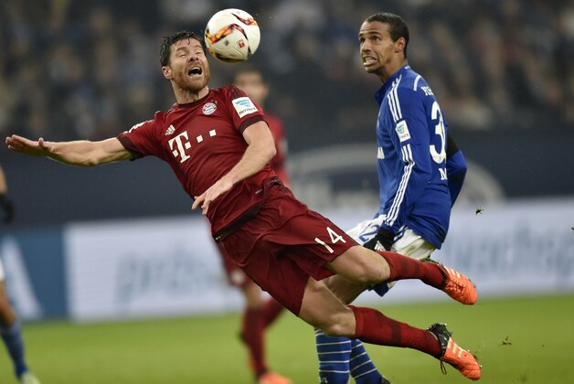 Bayern's Xabi Alonso, left, and Schalke's Joel Matip, right, jump for the ball during the German Bundesliga soccer match between FC Schalke 04 and Bayern Munich in Gelsenkirchen, Germany, Saturday, Nov. 21, 2015. Schalke was defeated by Bayern with 1-3. (AP Photo/Martin Meissner) Bayern's Xabi Alonso, left, and Schalke's Joel Matip, right, jump for the ball during the German Bundesliga soccer match between FC Schalke 04 and Bayern Munich in Gelsenkirchen, Germany, Saturday, Nov. 21, 2015. Schalke was defeated by Bayern with 1-3. (AP Photo/Martin Meissner)