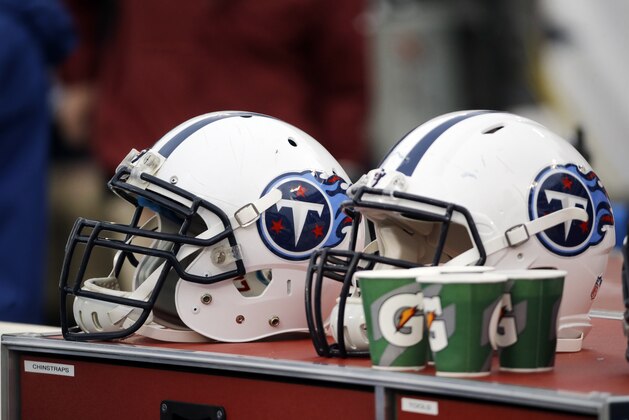 Tennessee Titans helmets sit on the sideline in the first half of an NFL football game between the Titans and the Jacksonville Jaguars Sunday, Dec. 6, 2015, in Nashville, Tenn. (AP Photo/James Kenney)