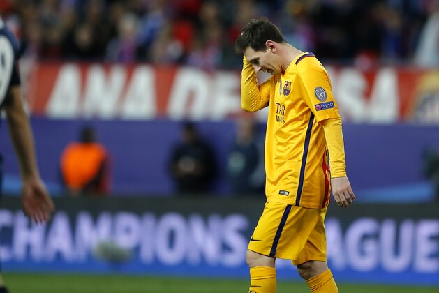 Barcelona's Lionel Messi walks on the pitch during the Champions League 2nd leg quarterfinal soccer match between Atletico Madrid and Barcelona at the Vicente Calderon stadium in Madrid, Spain, Wednesday April 13, 2016. Atletico defeated Barcelona by 2-0. (AP Photo/Paul White)