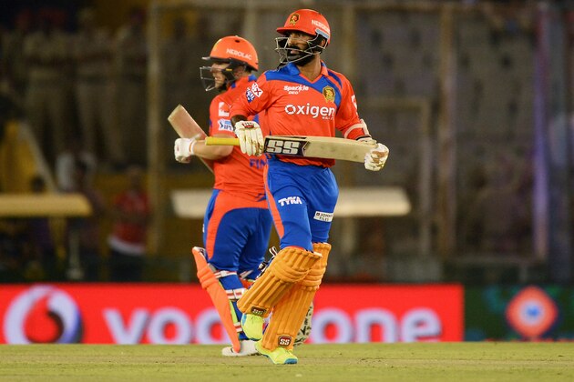 Gujarat Lions Dinesh Karthik (front) runs between the wickets along with Aaron Finch during the 2016 Indian Premier League (IPL) Twenty20 cricket match between Gujarat Lions and Kings XI Punjab at The Punjab Cricket Association Stadium in Mohali on April 11, 2016. ------IMAGE RESTRICTED TO EDITORIAL USE - STRICTLY NO COMMERCIAL USE- / AFP / SAJJAD HUSSAIN        (Photo credit should read SAJJAD HUSSAIN/AFP/Getty Images)
